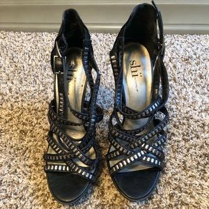 Black strappy heels with silver details